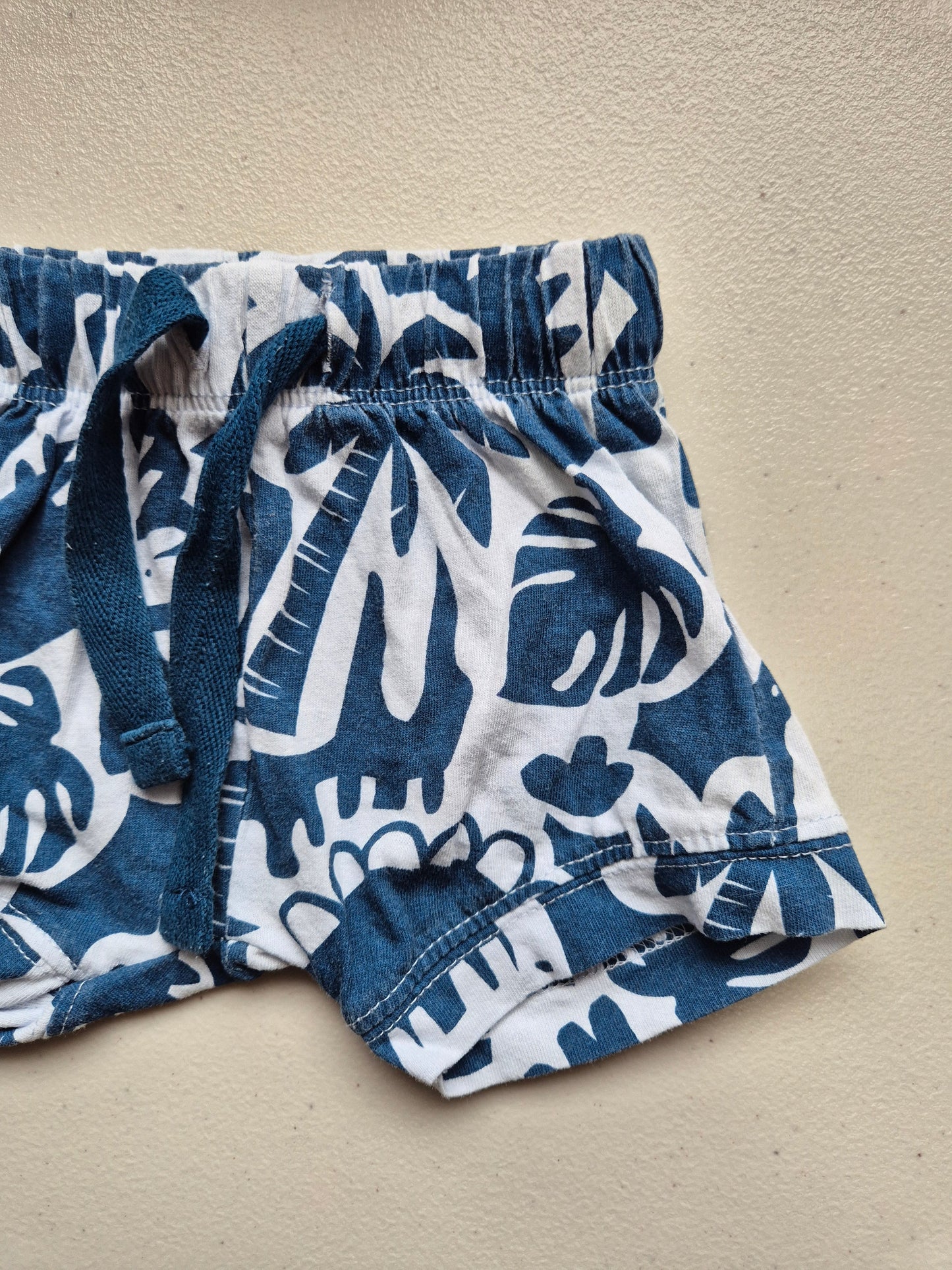 Blue and white patterned fabric on a beige background